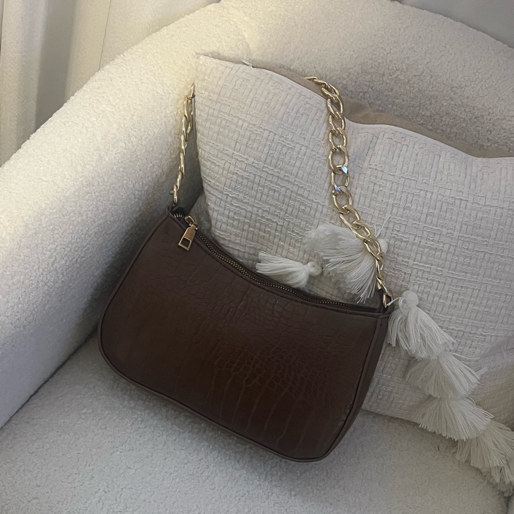 Brown and gold purse